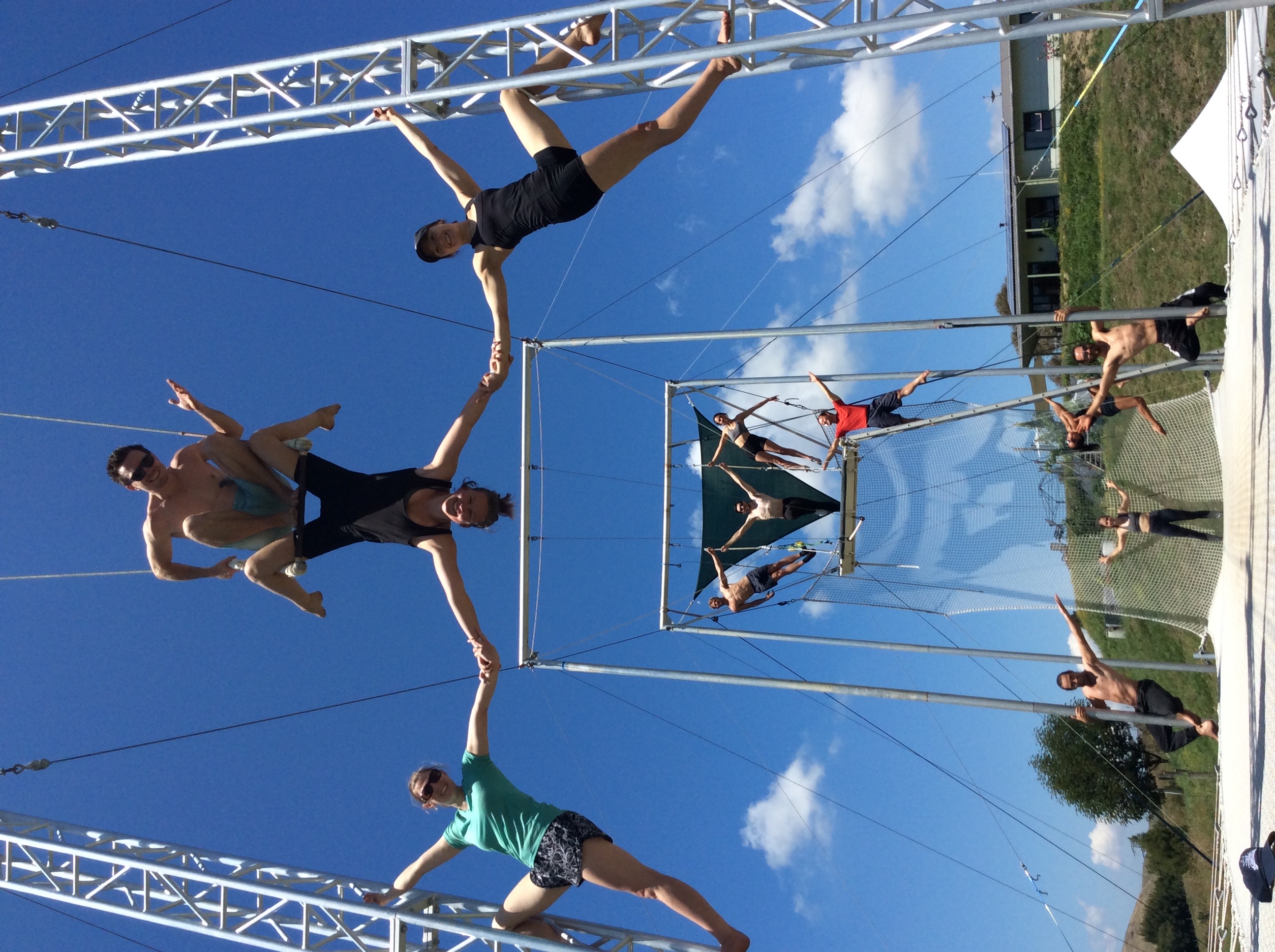 Group of aerialists performing on the flying trapeze rig at Hawkes Bay