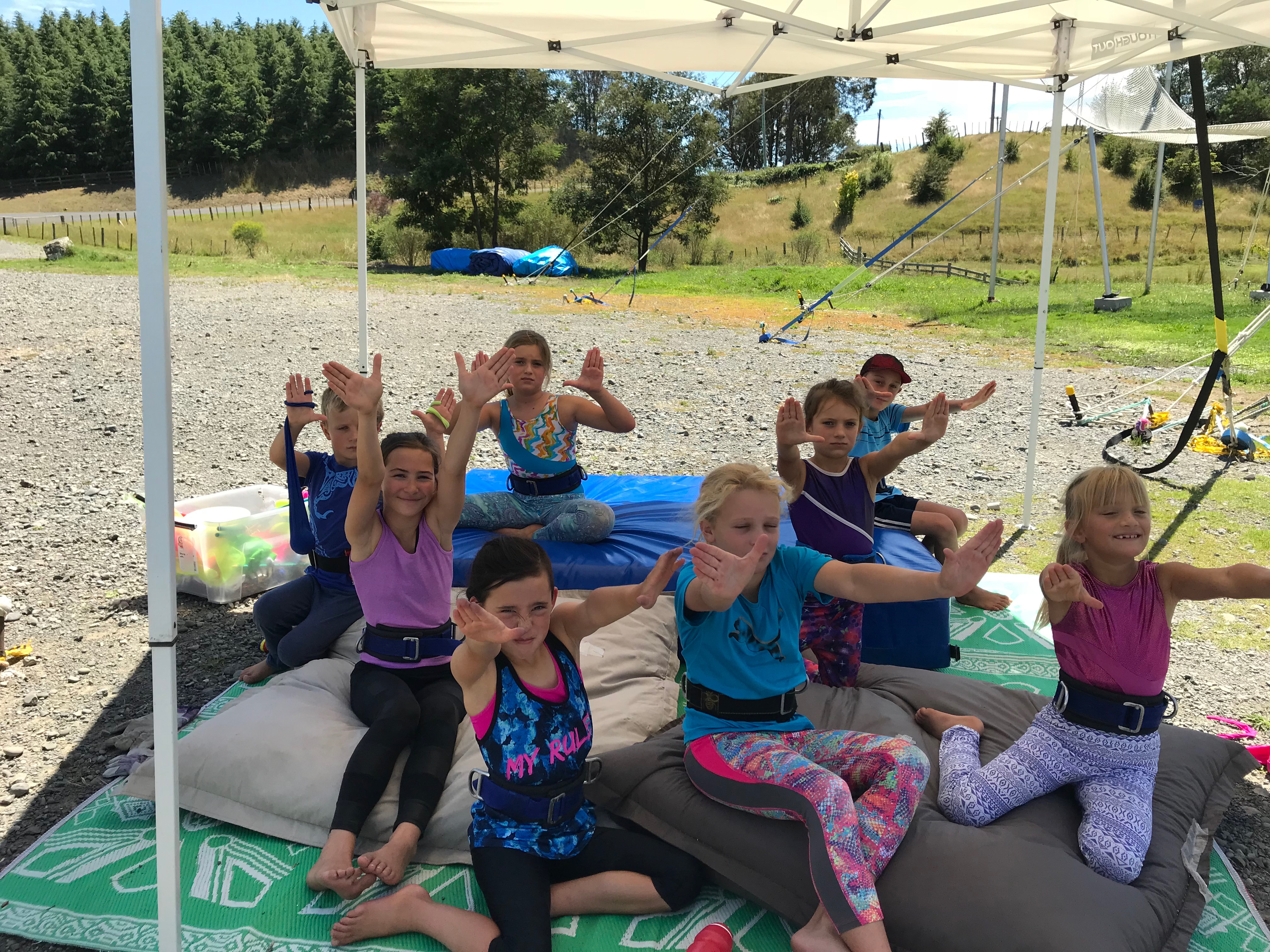 Kids in harnesses learning aerial skills at a birthday party at Hawkes Bay Flying Trapeze